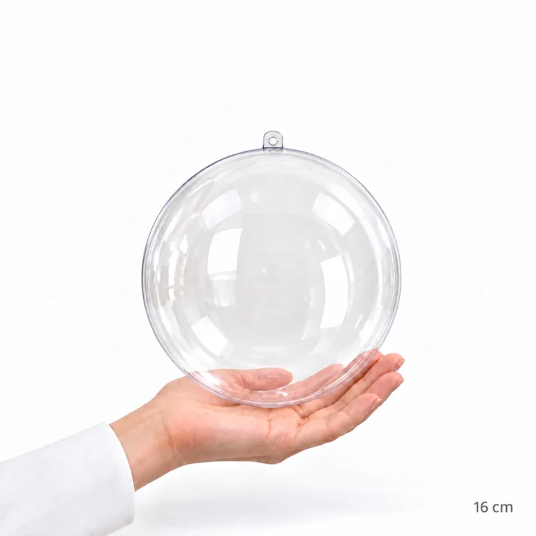 Esfera acrílica transparente de 16 cm sostenida en una mano como referencia de tamaño